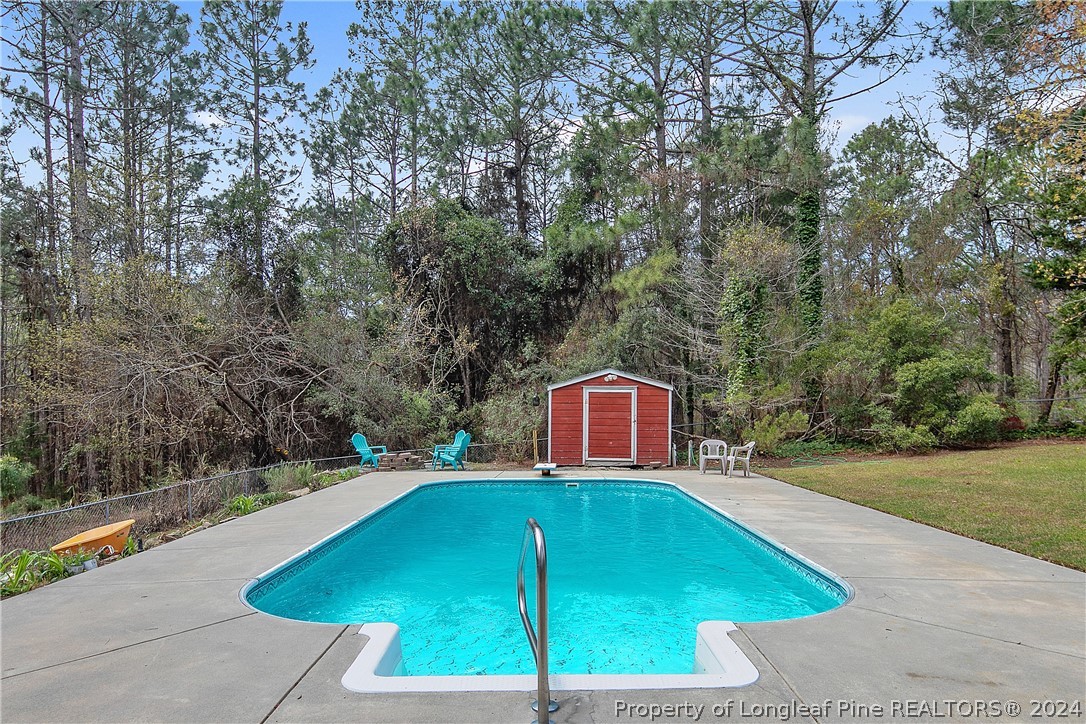 7833 Shuttle Road Fayetteville, NC 28311 - Photo 43 of 46 a view of a swimming pool with a patio