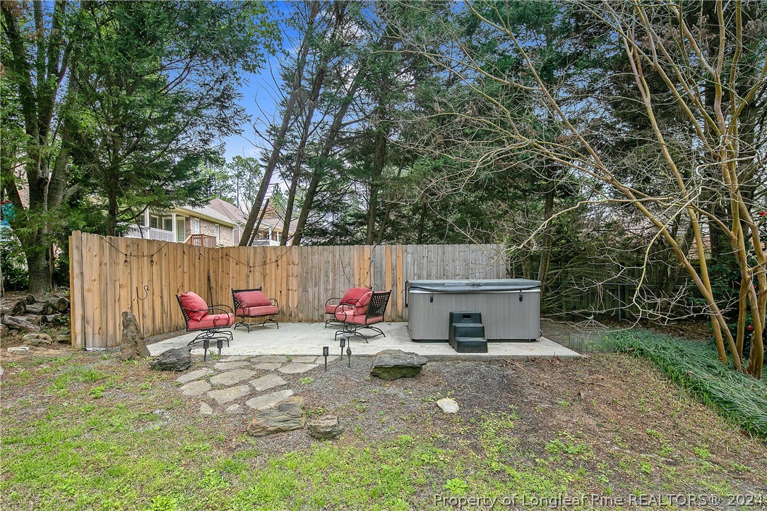 7833 Shuttle Road Fayetteville, NC 28311 - Photo 45 of 46 a view of backyard with small cabin and a chair