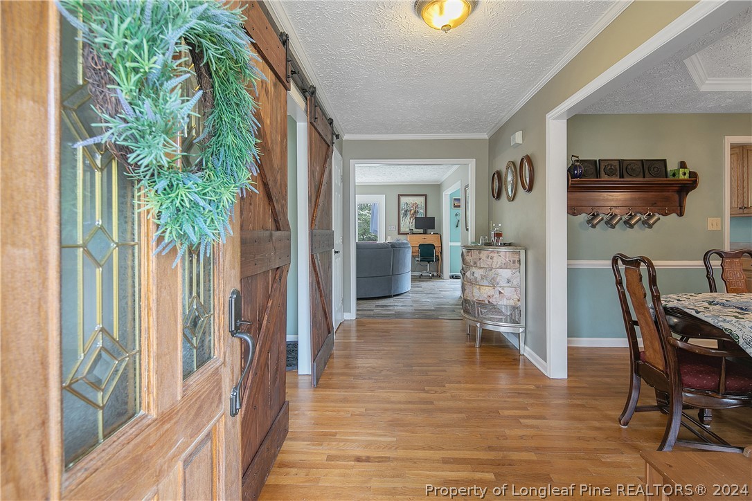 7833 Shuttle Road Fayetteville, NC 28311 - Photo 5 of 46 a view of a dining room with furniture window and wooden floor