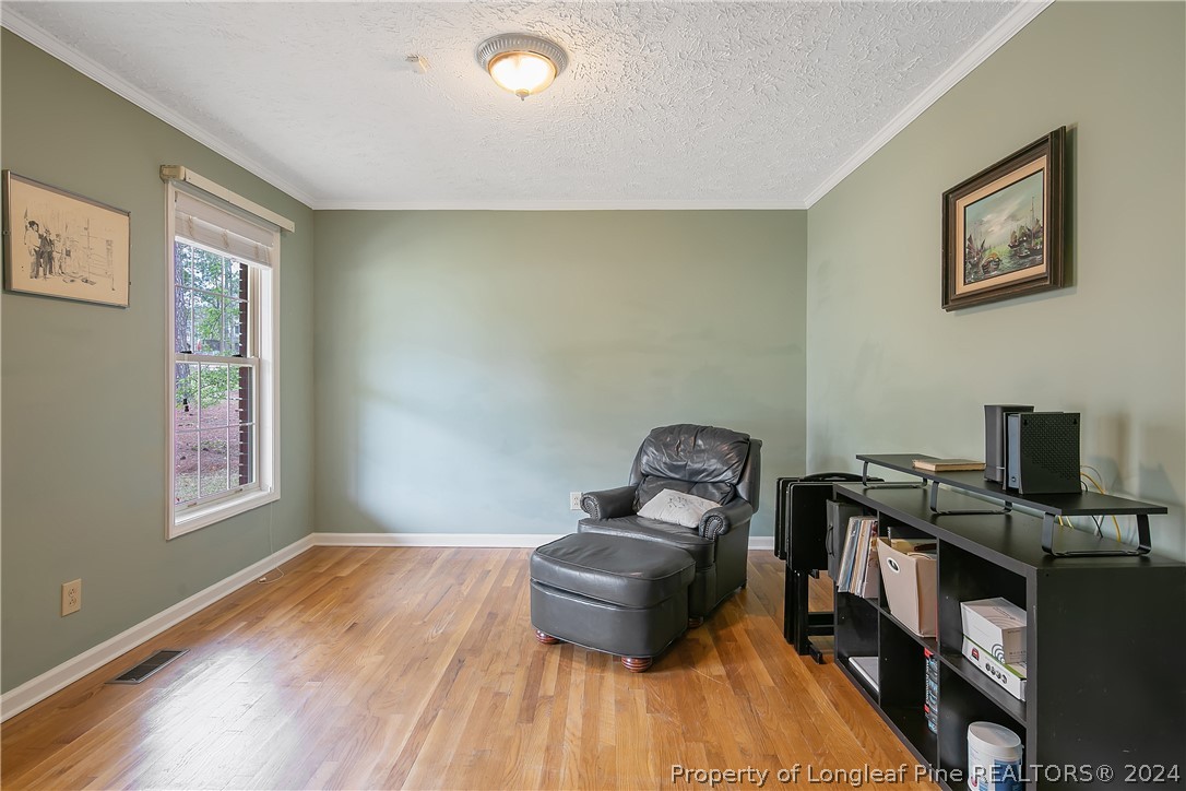 7833 Shuttle Road Fayetteville, NC 28311 - Photo 8 of 46 a living room with furniture and a window
