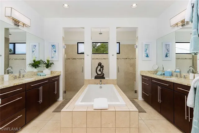 a spacious bathroom with a sink and a mirror