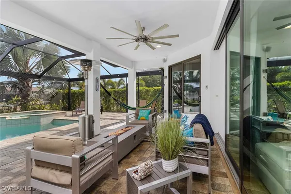 a living room with furniture a large window with outer view