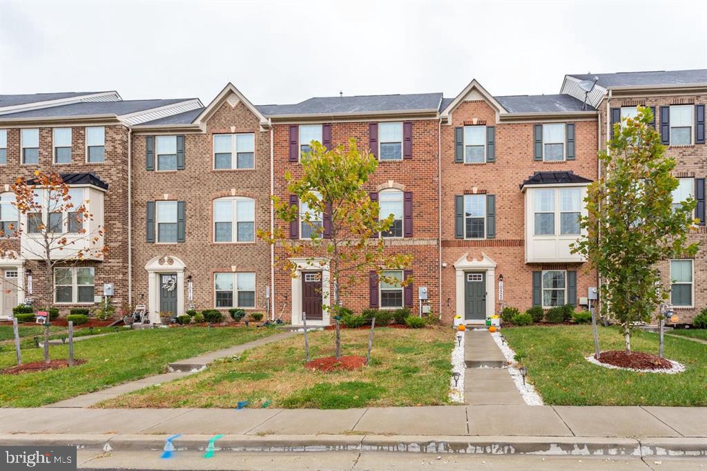 Charming townhomes with lush greenery.