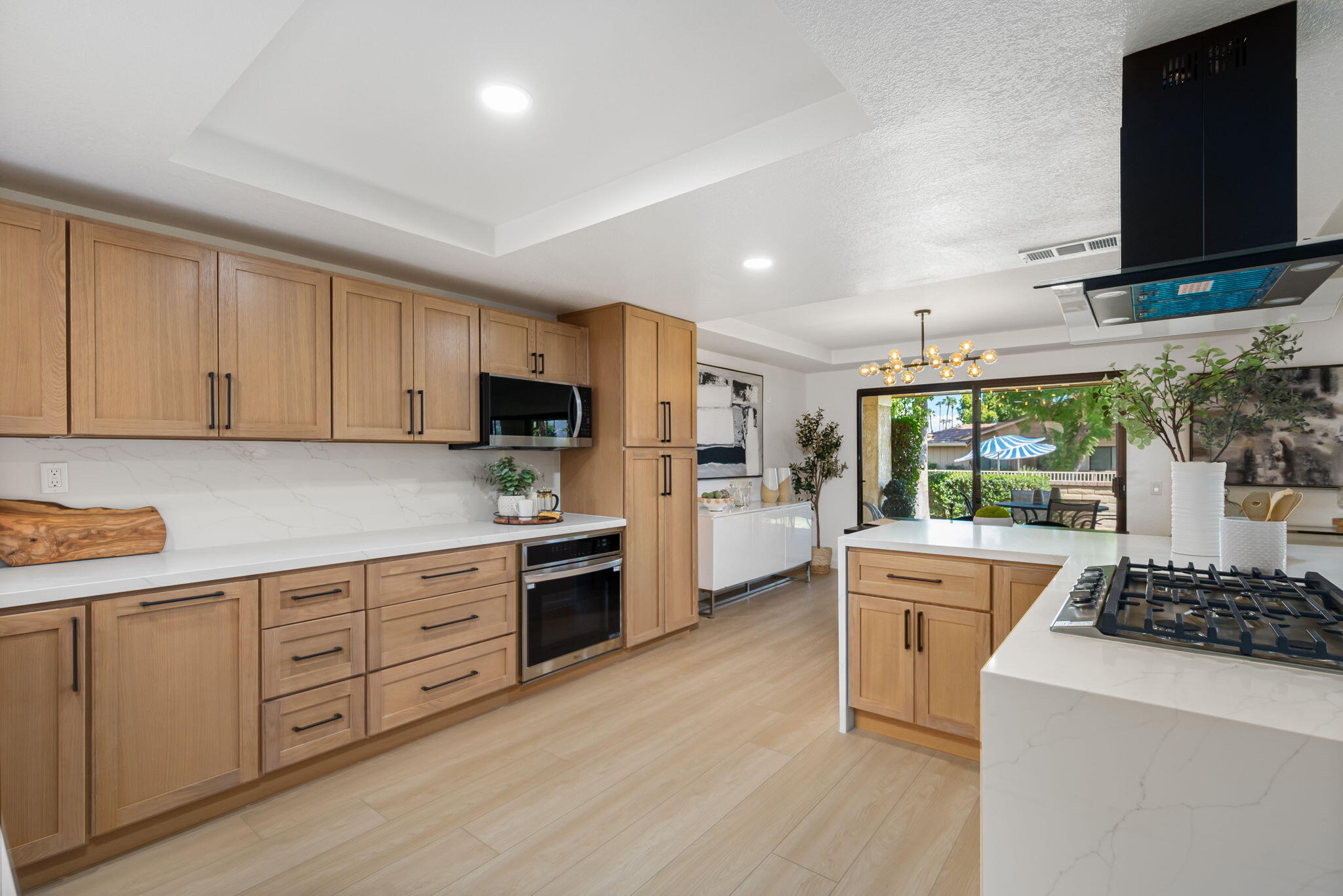 4 Maximo Way Palm Desert, CA 92260 - Photo 15 of 51 a kitchen with stainless steel appliances a stove a sink and a refrigerator