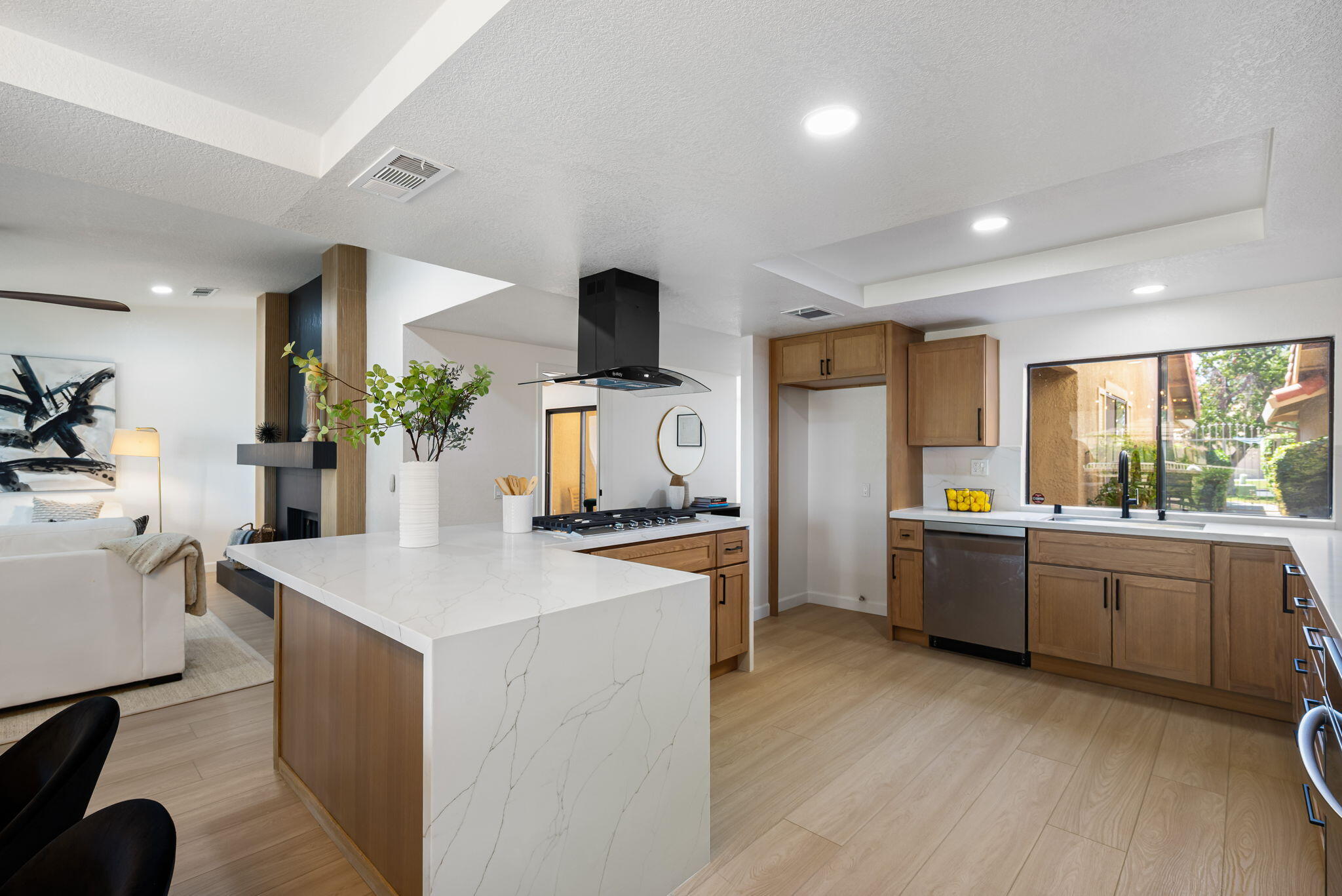 4 Maximo Way Palm Desert, CA 92260 - Photo 18 of 51 a kitchen that has a lot of cabinets in it and wooden floors