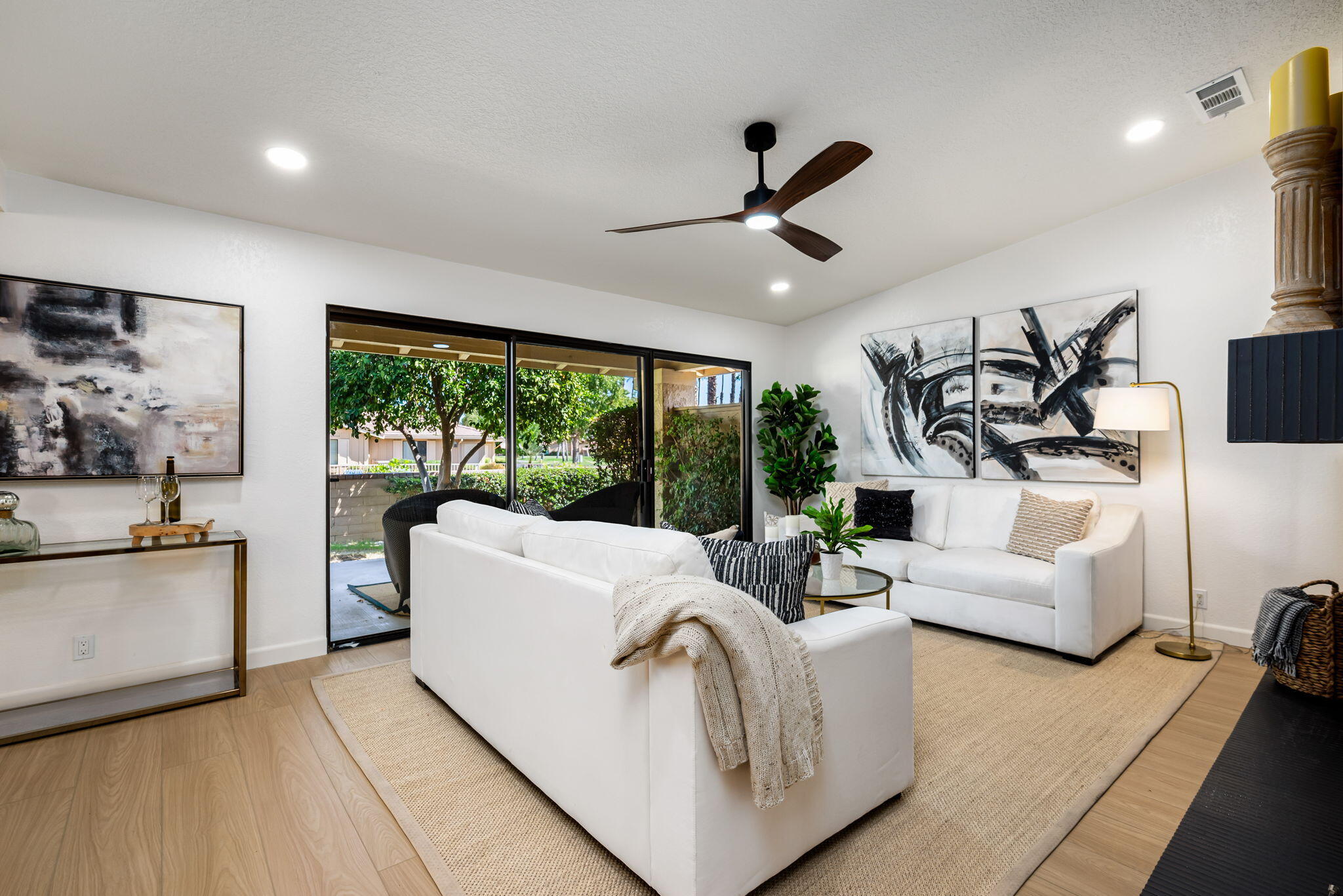 4 Maximo Way Palm Desert, CA 92260 - Photo 23 of 51 a living room with furniture and a large window