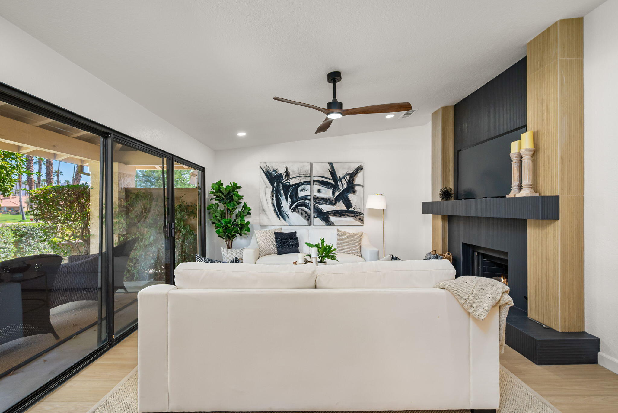 4 Maximo Way Palm Desert, CA 92260 - Photo 24 of 51 a living room with fireplace furniture and a large window