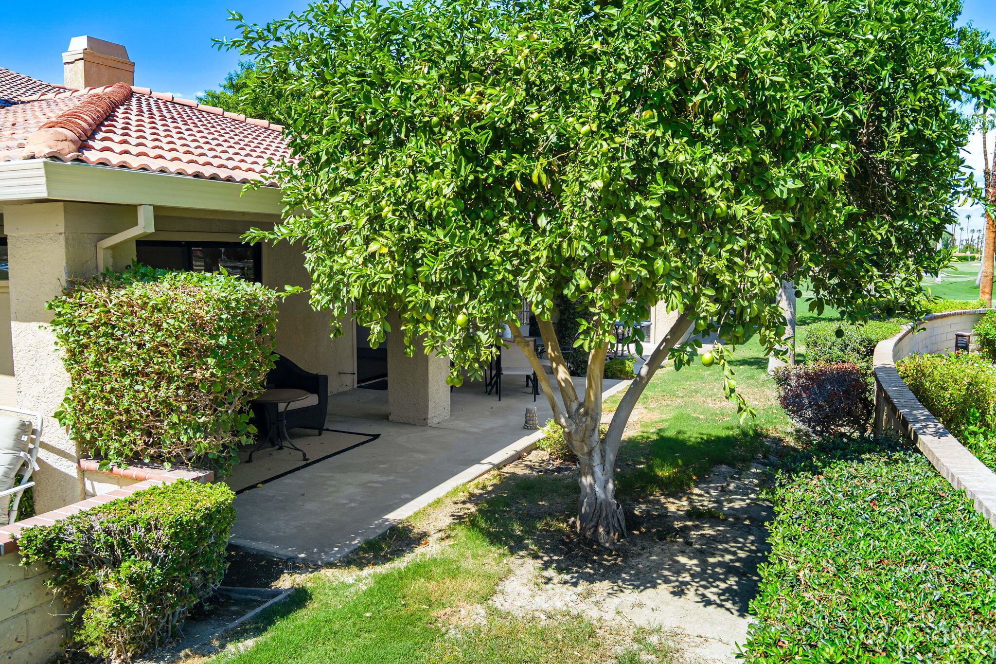 4 Maximo Way Palm Desert, CA 92260 - Photo 4 of 51 a front view of a house with garden