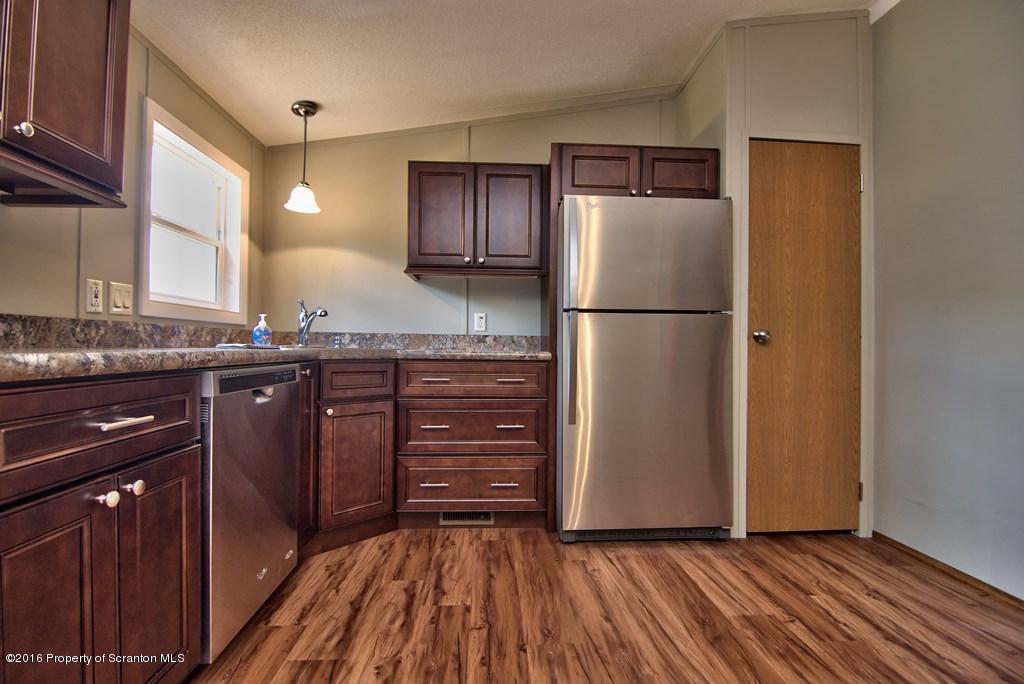 2131 Madisonville Road Moscow, PA 18444 - Photo 20 of 49 a kitchen with a refrigerator and a sink