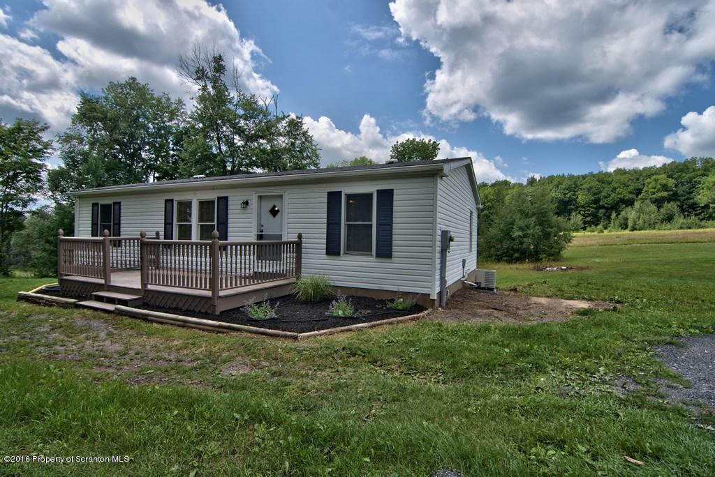 2131 Madisonville Road Moscow, PA 18444 - Photo 40 of 49 a view of a house with backyard and garden
