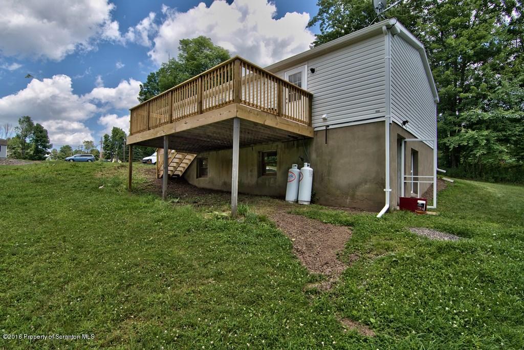 2131 Madisonville Road Moscow, PA 18444 - Photo 46 of 49 a view of a house with a yard and hanging chair