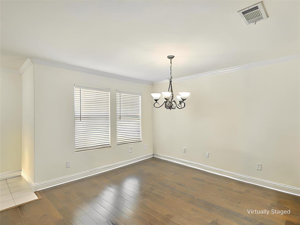 2549 Saddlehorn Drive Little Elm, TX 75068 - Photo 12 of 23 an empty room with chandelier fan and windows