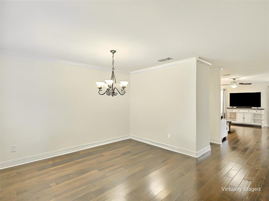 2549 Saddlehorn Drive Little Elm, TX 75068 - Photo 13 of 23 a view of a livingroom with wooden floor table and chairs