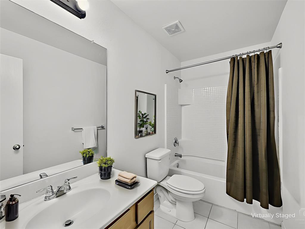 2549 Saddlehorn Drive Little Elm, TX 75068 - Photo 18 of 23 a bathroom with a sink toilet and shower