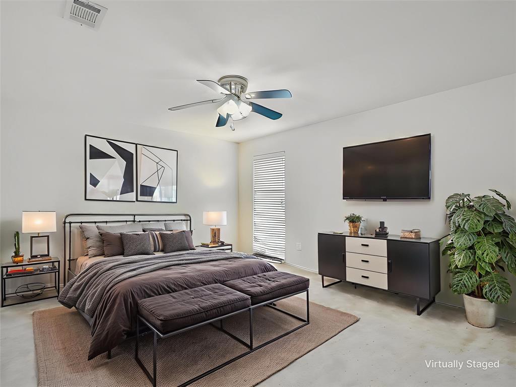 2549 Saddlehorn Drive Little Elm, TX 75068 - Photo 19 of 23 a bedroom with a bed and a flat screen tv