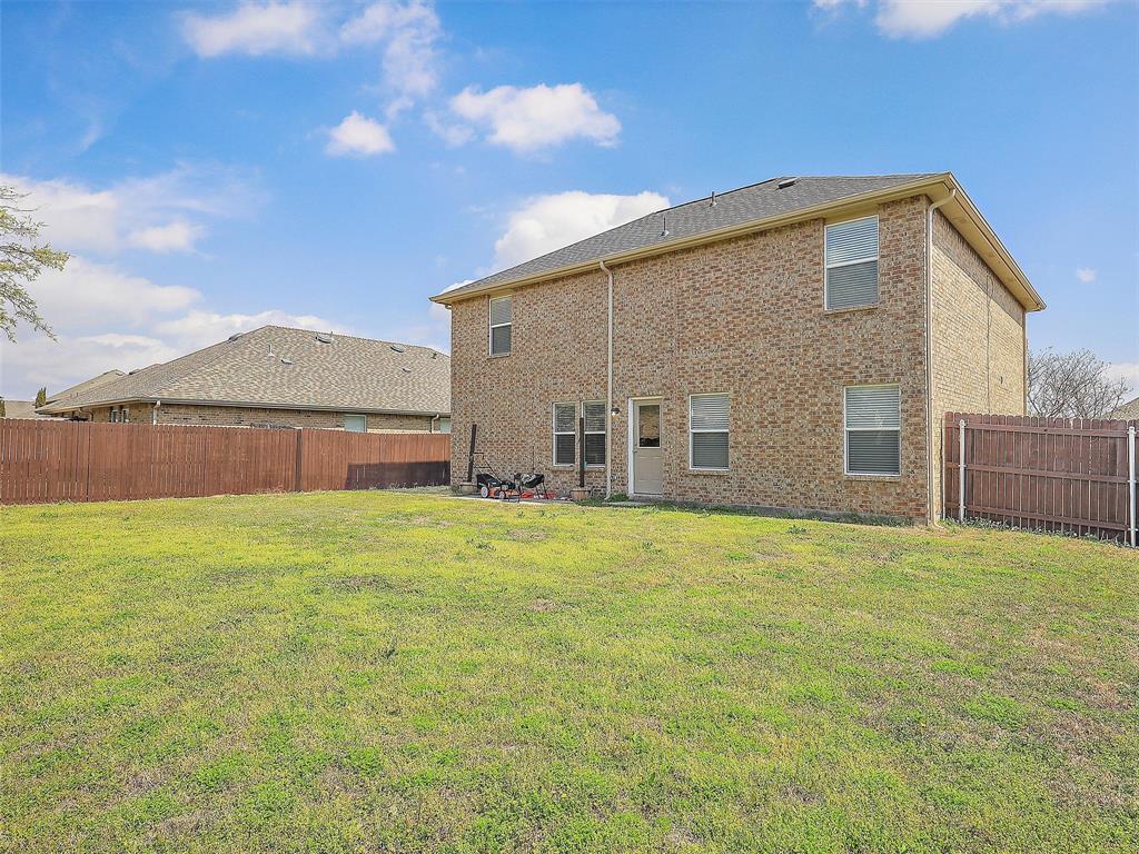 2549 Saddlehorn Drive Little Elm, TX 75068 - Photo 21 of 23 a view of an house with backyard and garden