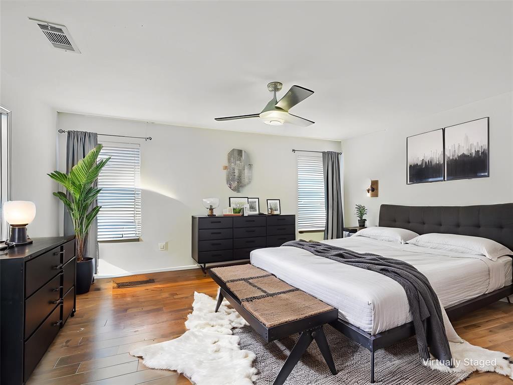 2549 Saddlehorn Drive Little Elm, TX 75068 - Photo 5 of 23 a bedroom with a bed and wooden floor