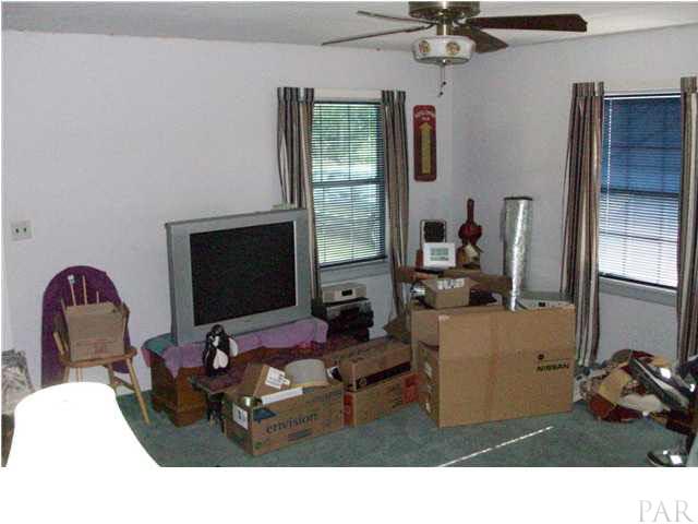 1042 Isabella Road Cantonment, FL 32533 - Photo 6 of 19 LIVING ROOM FROM HALLWAY ANGLE