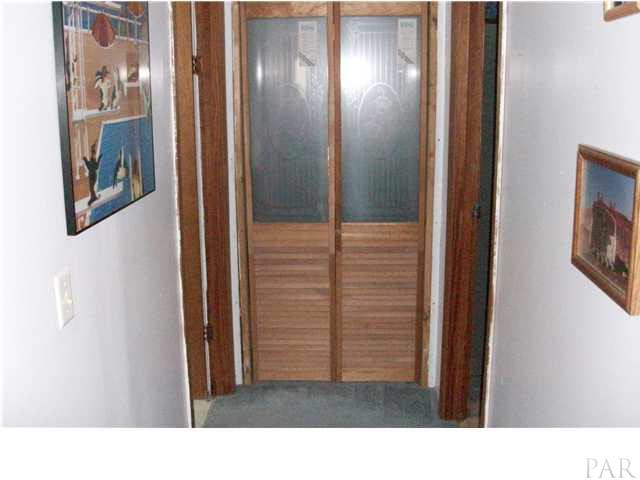 1042 Isabella Road Cantonment, FL 32533 - Photo 8 of 19 HALLWAY WITH LOVELY ETCHED GLASS DOORS ON THE CLOSET