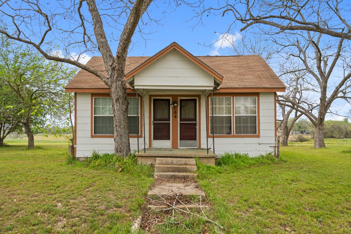 104 Kessler Street Hallettsville, TX 77964 - Photo 14 of 18 a front view of a house with garden