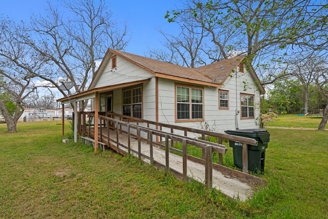 104 Kessler Street Hallettsville, TX 77964 - Photo 16 of 18 a view of a house with a yard