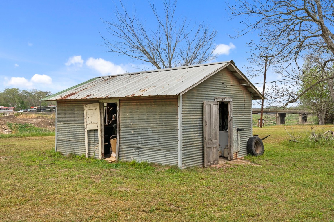 104 Kessler Street Hallettsville, TX 77964 - Photo 17 of 18 a view of a house with a yard
