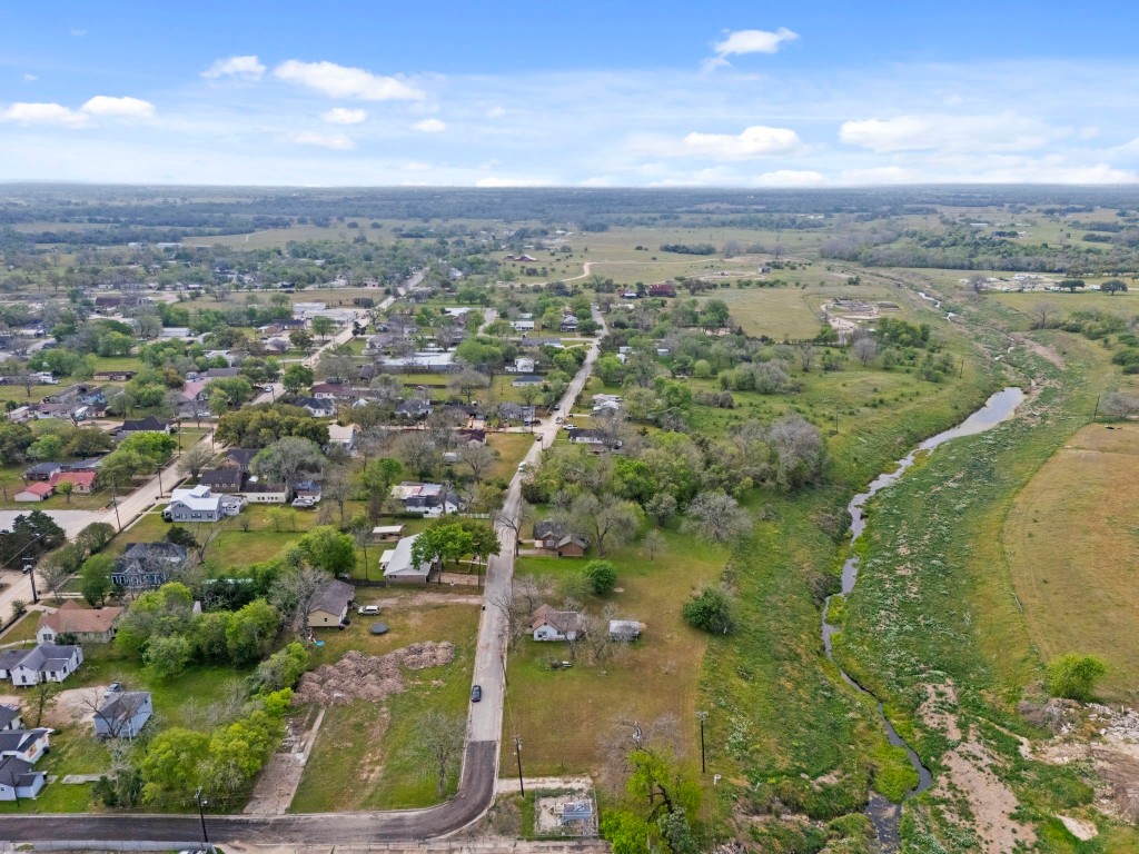 104 Kessler Street Hallettsville, TX 77964 - Photo 3 of 18 a view of a lake with a city