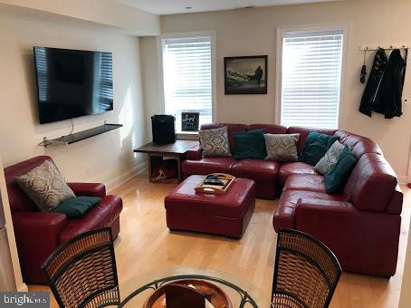 3925 Fulton Street Northwest, Unit 5 Washington, DC 20007 - Photo 4 of 19 a living room with furniture and a flat screen tv