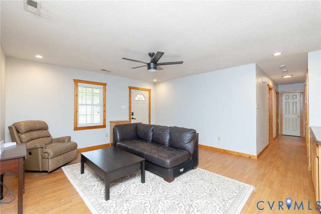 460 Horseshoe Road Jarratt, VA 23867 - Photo 4 of 24 a living room with furniture and a rug
