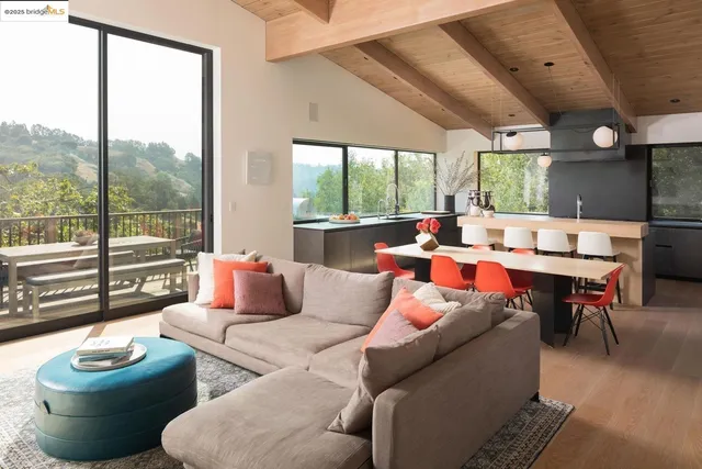a living room with furniture and flat screen tv