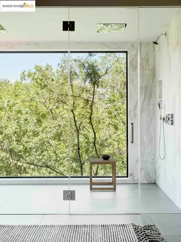 a bedroom with a bed lamp and window