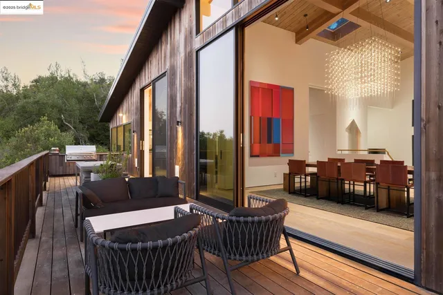 a view of balcony with couch and wooden floor