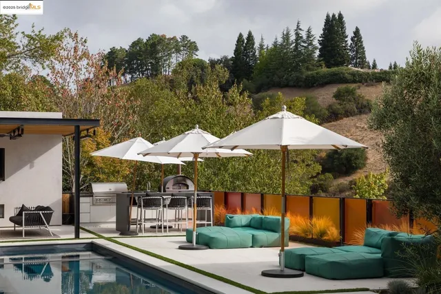 an aerial view of a house with garden space and street view