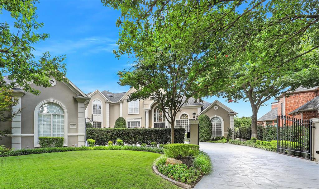 5501 Roland Drive Plano, TX 75093 - Photo 1 of 1 a front view of a house with a garden and trees