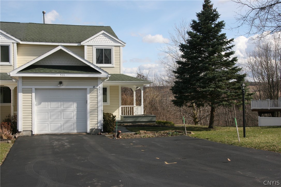 End unit with private yard and double driveway