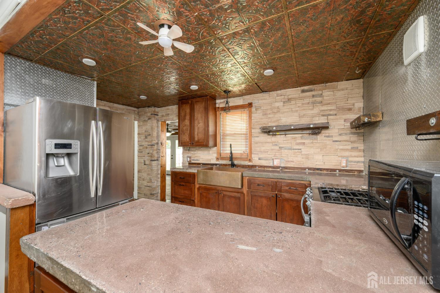 212 Echo Avenue Edison, NJ 08837 - Photo 11 of 42 a large kitchen with kitchen island a stove a sink a refrigerator and dishwasher
