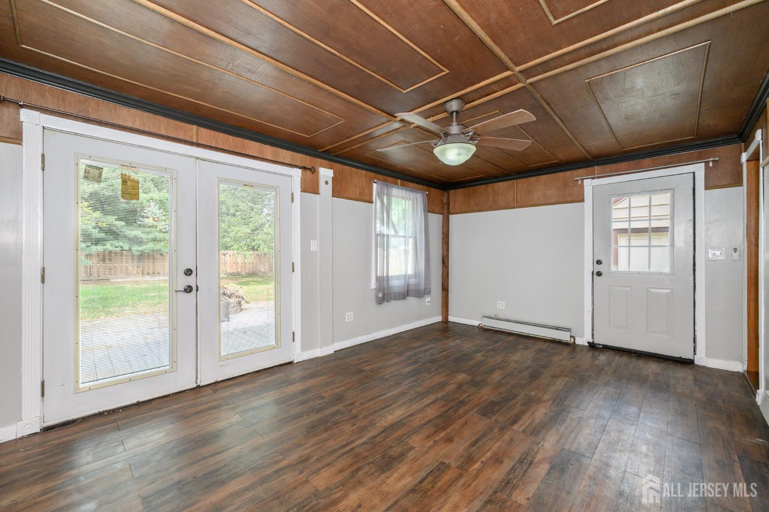 212 Echo Avenue Edison, NJ 08837 - Photo 15 of 42 a view of empty room with wooden floor and fan