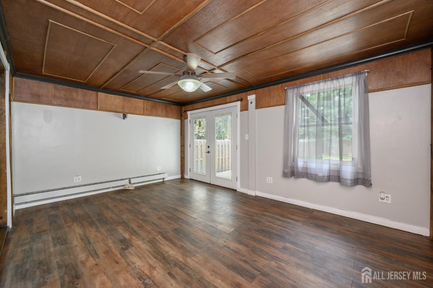212 Echo Avenue Edison, NJ 08837 - Photo 18 of 42 a view of empty room with wooden floor and fan