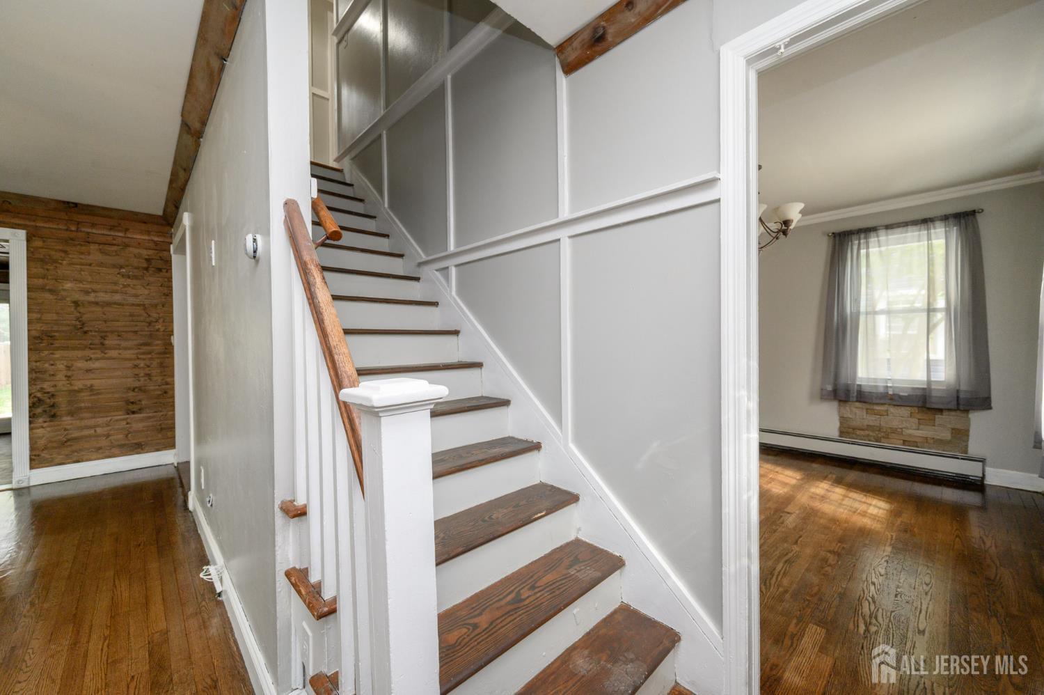 212 Echo Avenue Edison, NJ 08837 - Photo 19 of 42 a view of a hallway with wooden floor and entryway