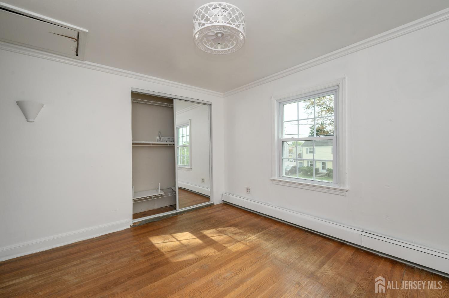 212 Echo Avenue Edison, NJ 08837 - Photo 29 of 42 a view of an empty room with a window