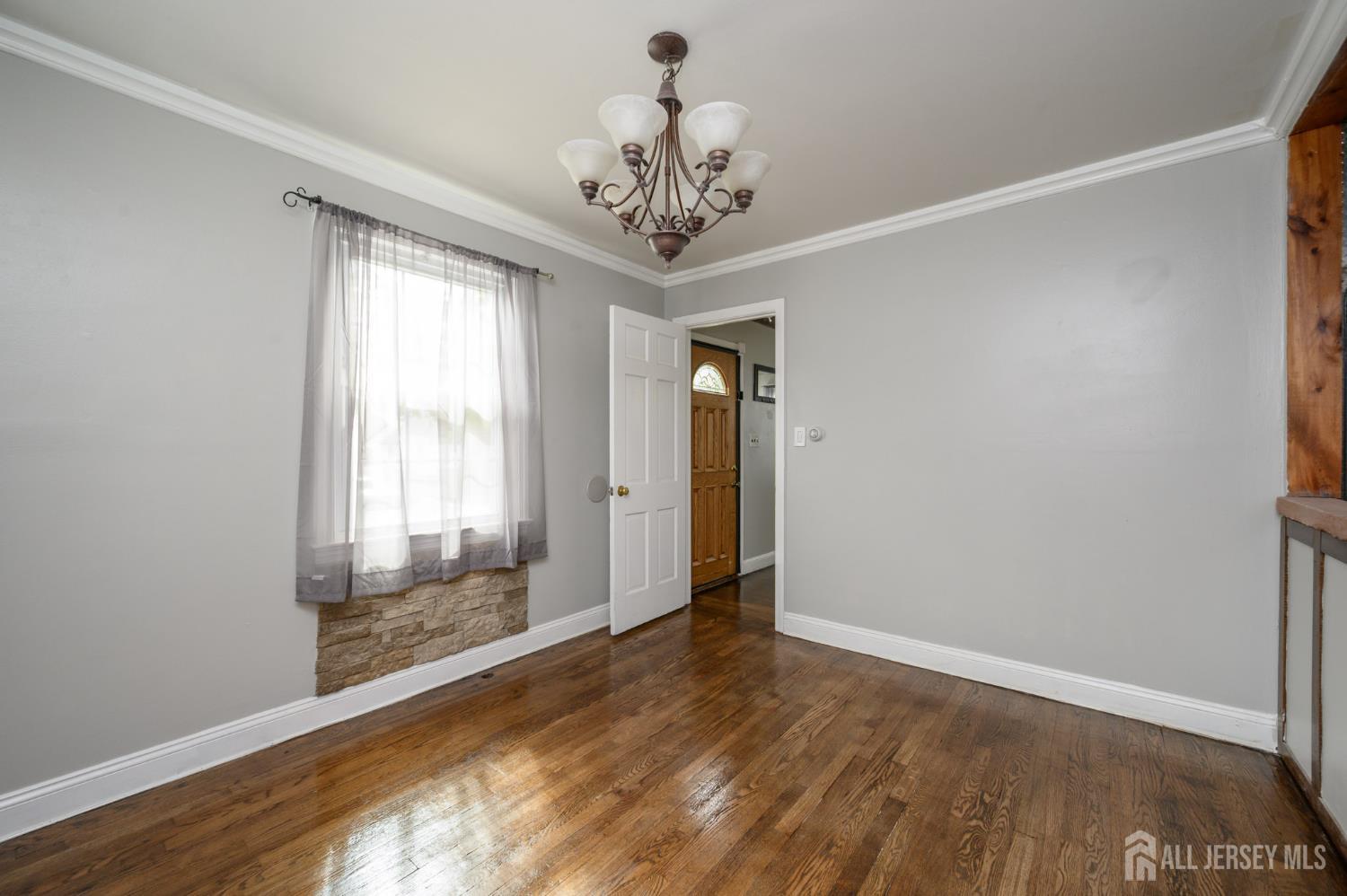 212 Echo Avenue Edison, NJ 08837 - Photo 6 of 42 a view of an empty room with a window