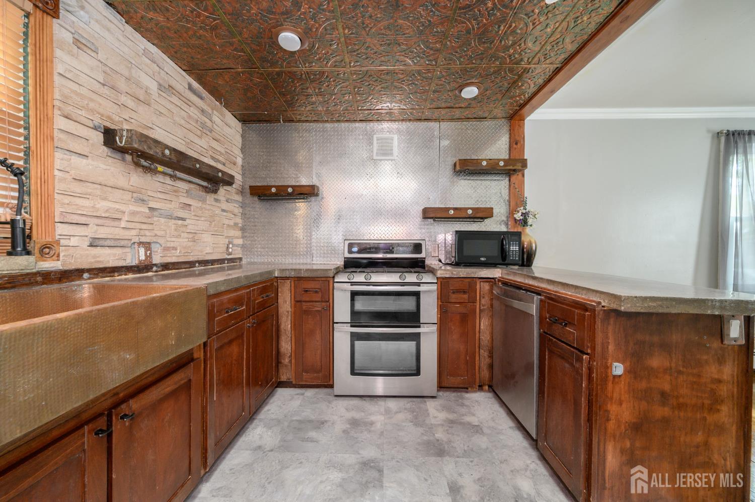 212 Echo Avenue Edison, NJ 08837 - Photo 10 of 42 a kitchen with granite countertop a sink and stainless steel appliances