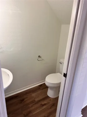 a bathroom with a toilet and a sink