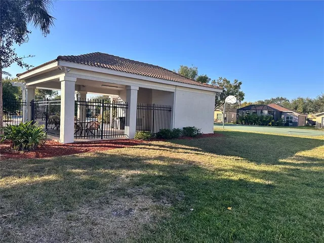 a view of a house with a yard and garage