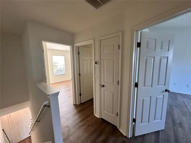 a view of an entryway with wooden floor