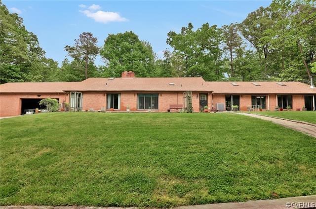 12279 Hanover Courthouse Road Hanover, VA 23069 - Photo 24 of 24 a front view of a house with a garden