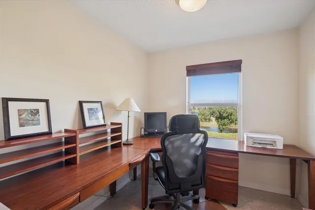 a workspace with furniture and a window