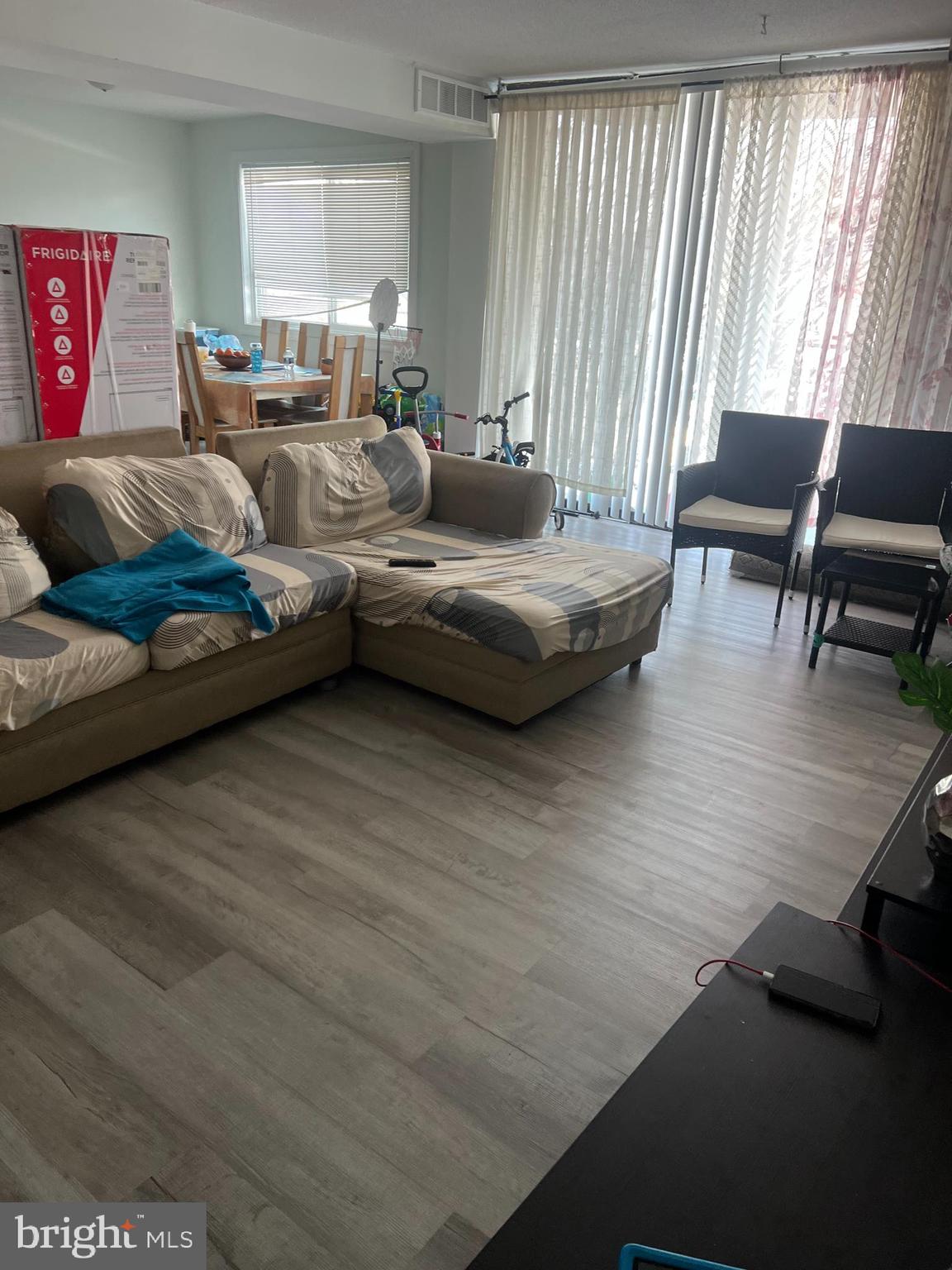 1836 Metzerott Road, Unit 422 Hyattsville, MD 20783 - Photo 8 of 12 a living room with furniture and a large window