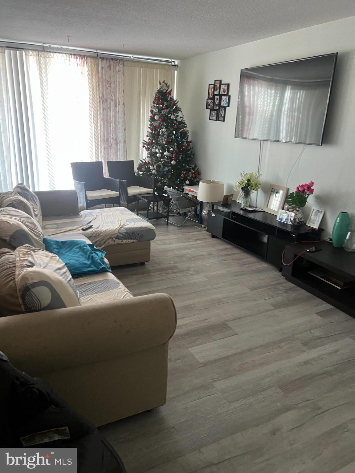 1836 Metzerott Road, Unit 422 Hyattsville, MD 20783 - Photo 10 of 12 a living room with furniture and a window