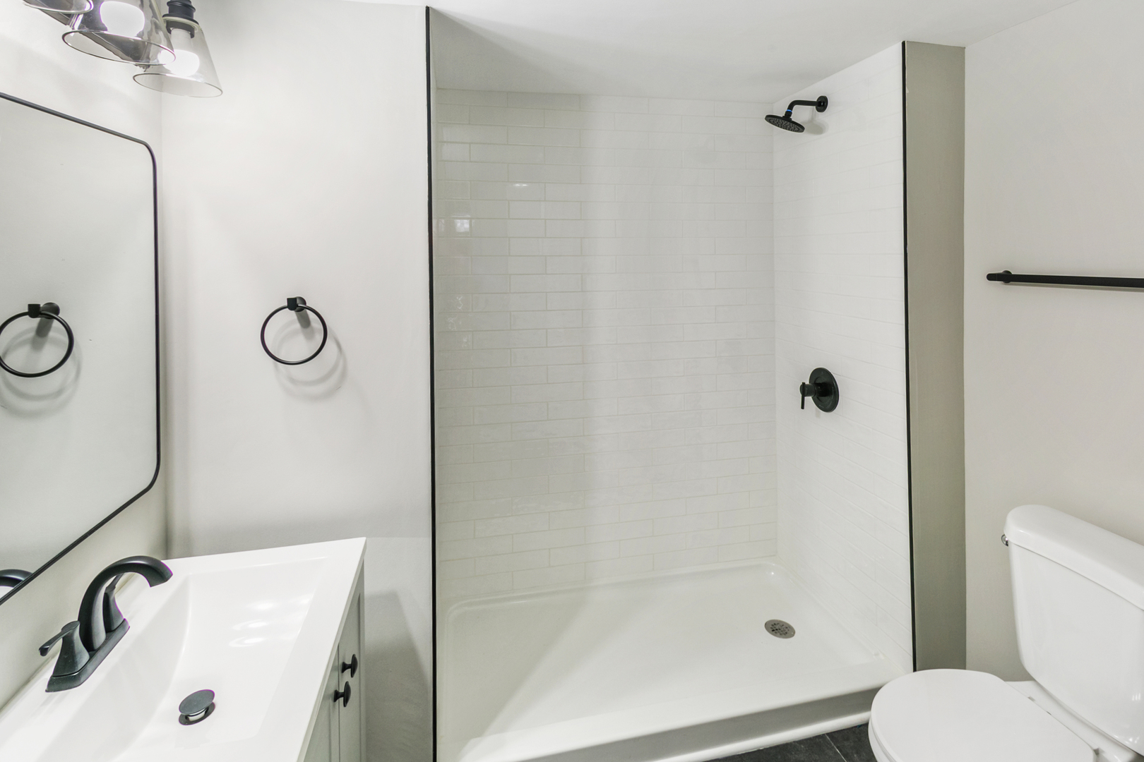 214 North Gay Court Glenwood, IL 60425 - Photo 11 of 20 a bathroom with a sink and a shower